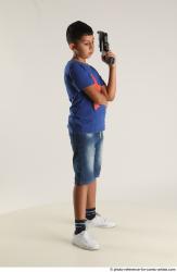 TIMBO STANDING POSE WITH GUN